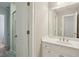 Bright bathroom featuring a shower, mirror, and vanity with storage at 315 Glengarry Chase, Covington, GA 30014