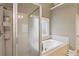 Luxurious bathroom featuring a glass-enclosed shower and a soaking tub for relaxation at 315 Glengarry Chase, Covington, GA 30014