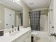 Bathroom featuring vanity with a mirror, a shower, and a toilet at 315 Glengarry Chase, Covington, GA 30014