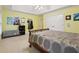 Bedroom featuring a ceiling fan, large bed, and storage at 315 Glengarry Chase, Covington, GA 30014