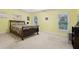 Bedroom with two windows, neutral carpet, and a large bed at 315 Glengarry Chase, Covington, GA 30014
