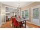 Bright breakfast nook with hardwood floors and views to the backyard at 315 Glengarry Chase, Covington, GA 30014