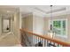 Hallway landing with hardwood railing and light fixture at 315 Glengarry Chase, Covington, GA 30014