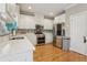 Well-equipped kitchen with stainless steel appliances, granite countertops, and white cabinetry at 315 Glengarry Chase, Covington, GA 30014