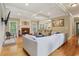 Cozy living room with fireplace, hardwood floors, and natural light at 315 Glengarry Chase, Covington, GA 30014
