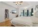 Charming main bedroom showcases hardwood floors, bay windows, and access to the staircase at 315 Glengarry Chase, Covington, GA 30014