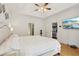 Bright main bedroom with hardwood floors features a large bed, TV, and ample space at 315 Glengarry Chase, Covington, GA 30014