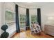 Cozy seating area features natural light, stylish furniture, and offers views of the exterior landscape at 315 Glengarry Chase, Covington, GA 30014