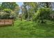 Large backyard with a wooden deck and well-maintained lawn, perfect for outdoor activities at 3301 Irish Ln, Decatur, GA 30032