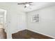 Bright bedroom with ceiling fan, hardwood floors, and closet at 3301 Irish Ln, Decatur, GA 30032