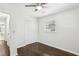 Bright bedroom with ceiling fan, hardwood floors, and closet at 3301 Irish Ln, Decatur, GA 30032