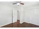 Empty bedroom with hardwood floors, a ceiling fan, and a closet at 3301 Irish Ln, Decatur, GA 30032