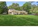 Traditional brick ranch-style home with large front yard and covered parking at 3301 Irish Ln, Decatur, GA 30032