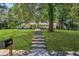 Attractive brick house with a large front yard and a stepped walkway leading to the entrance at 3301 Irish Ln, Decatur, GA 30032