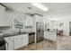 Bright kitchen featuring white cabinetry, stainless steel appliances, and granite countertops at 3301 Irish Ln, Decatur, GA 30032