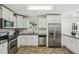 Kitchen with stainless appliances, granite countertops, and tiled backsplash at 3301 Irish Ln, Decatur, GA 30032