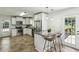 Open kitchen with breakfast bar and stainless steel appliances, offering a modern and inviting space at 3301 Irish Ln, Decatur, GA 30032