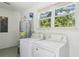 Laundry room with washer, dryer, and natural light at 3301 Irish Ln, Decatur, GA 30032
