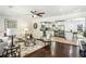 Inviting open-concept living area with hardwood floors, leading into a modern kitchen with white cabinets at 3301 Irish Ln, Decatur, GA 30032