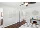 Bright main bedroom features hardwood floors, ceiling fan, and lots of closet space at 3301 Irish Ln, Decatur, GA 30032