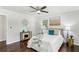 Serene main bedroom featuring hardwood floors, a ceiling fan, and neutral decor at 3301 Irish Ln, Decatur, GA 30032