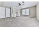 Spacious bedroom includes a ceiling fan, built-in shelves and cabinets, and a large window at 4601 Ethel Springs Sw Trl, Mableton, GA 30126