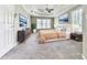 Primary bedroom features a tray ceiling, plush carpet and windows with blinds for privacy at 4601 Ethel Springs Sw Trl, Mableton, GA 30126