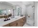 Beautiful bathroom with a glass-enclosed shower, dual sinks, spacious vanity, and modern mirrors at 1492 Wicker Wood Se Pl # 24, Smyrna, GA 30080