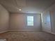 Spacious carpeted bedroom with window at 1672 Fuma Leaf Way, Mcdonough, GA 30252