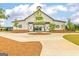 Community clubhouse with covered entry, neutral colors, landscaping and concrete walkways at 1672 Fuma Leaf Way, Mcdonough, GA 30252