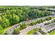 Aerial view of townhomes featuring a beautiful community surrounded by mature trees at 2348 Bigwood Trl, Atlanta, GA 30349