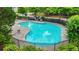 Aerial shot of the large neighborhood swimming pool with surrounding foliage at 2348 Bigwood Trl, Atlanta, GA 30349