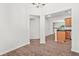 Bright, open-concept space featuring hardwood floors and seamless flow between dining area and adjacent kitchen at 2348 Bigwood Trl, Atlanta, GA 30349