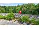 Aerial view of lovely townhomes featuring well-manicured lawns and mature trees at 2348 Bigwood Trl, Atlanta, GA 30349