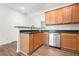 Updated kitchen features sleek countertops, stainless steel appliances and wood cabinets for a modern look at 2348 Bigwood Trl, Atlanta, GA 30349