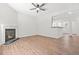 Bright living room features a fireplace and hardwood floors at 2348 Bigwood Trl, Atlanta, GA 30349