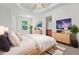 Cozy main bedroom featuring modern decor and lots of natural light at 2348 Bigwood Trl, Atlanta, GA 30349