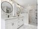Modern bathroom with double sinks, marble countertops, and a walk-in shower at 2411 Second Ave, Decatur, GA 30032