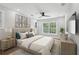 Bright bedroom with a large window, neutral décor, and a comfortable king-sized bed at 2411 Second Ave, Decatur, GA 30032