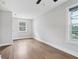 Bedroom featuring hardwood floors and natural light from a large window at 2411 Second Ave, Decatur, GA 30032