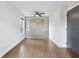 Bedroom with gray Murphy bed, hardwood floors, and natural lighting at 2411 Second Ave, Decatur, GA 30032