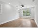 Sunlit bedroom with hardwood floors and a large window overlooking a lush yard at 2411 Second Ave, Decatur, GA 30032
