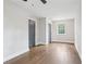 Bright bedroom with hardwood floors and a gray painted door at 2411 Second Ave, Decatur, GA 30032