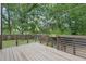 Wooden deck with metal framing overlooking a green backyard at 2411 Second Ave, Decatur, GA 30032