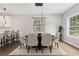 Elegantly staged dining room with modern lighting and space for entertaining at 2411 Second Ave, Decatur, GA 30032