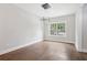 Dining area featuring modern lighting, hardwood floors, and large window at 2411 Second Ave, Decatur, GA 30032