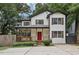 Charming two-story home with a welcoming front porch and a vibrant red door at 2411 Second Ave, Decatur, GA 30032