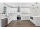 Well-equipped kitchen with stainless steel appliances, white cabinets, and modern fixtures at 2411 Second Ave, Decatur, GA 30032