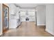 Open kitchen boasts white cabinets, stainless steel appliances, and hardwood floors at 2411 Second Ave, Decatur, GA 30032