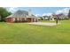 Large backyard featuring a basketball court, offering ample space for play and relaxation at 2825 Ellenwood Village Way, Ellenwood, GA 30294